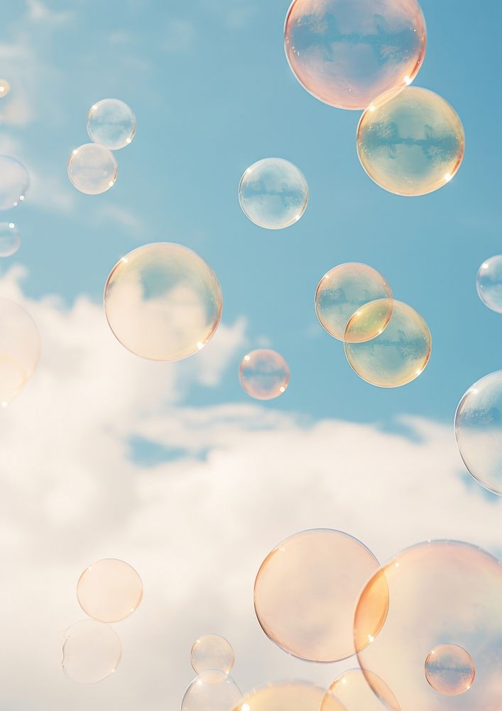 A group of soap bubbles floating in the cloud sky backgrounds outdoors nature.