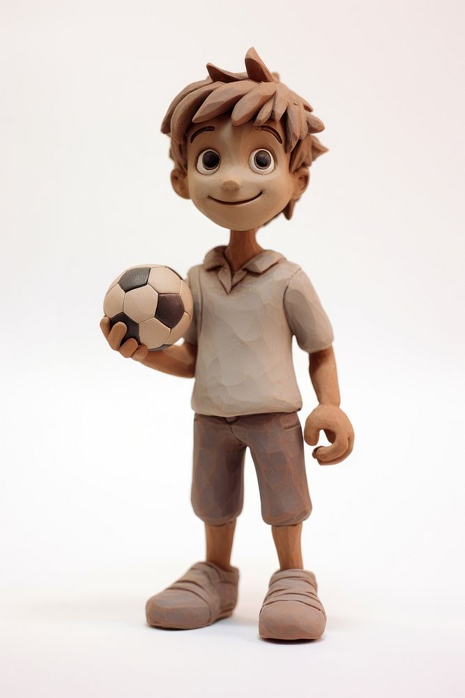 Boy play football made up of clay figurine sports toy.