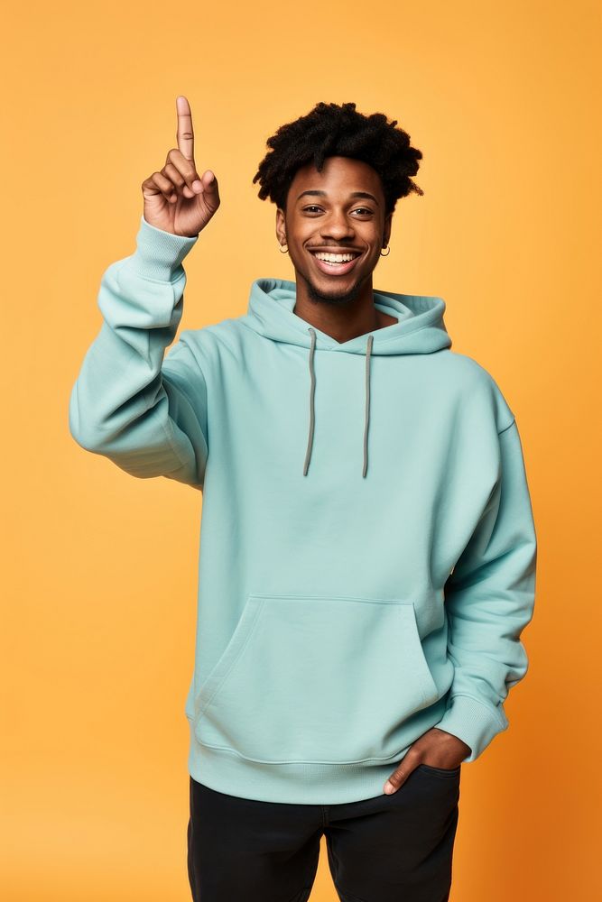 Young black man in sweatshirt with his arm up smile happy architecture. AI generated Image by rawpixel.