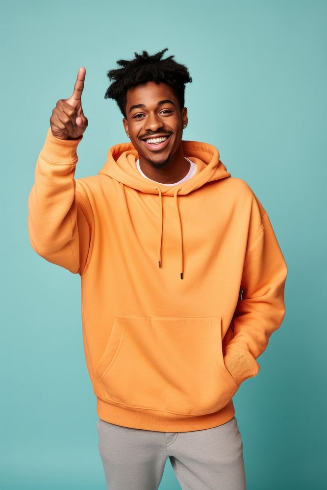 Young black man in sweatshirt with his arm up sweater smile happy. AI generated Image by rawpixel.