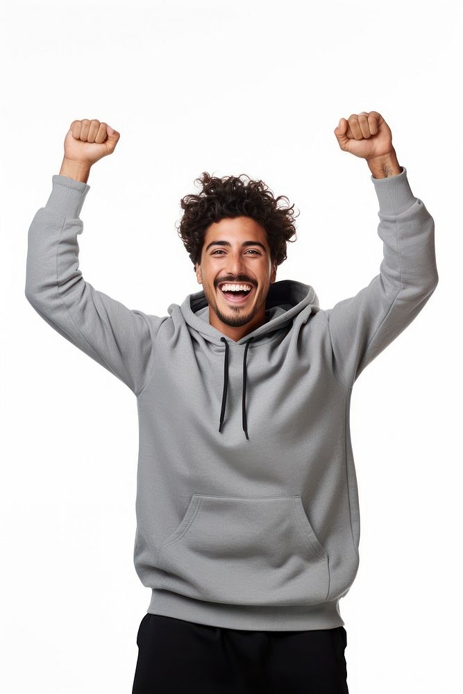 Young latin man in sweatshirt with his arm stretching up over his back head laughing shouting happy. AI generated Image by…