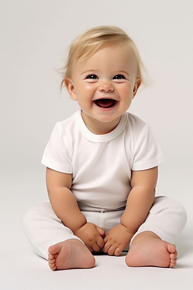 A Young cute european baby laughing portrait sitting.