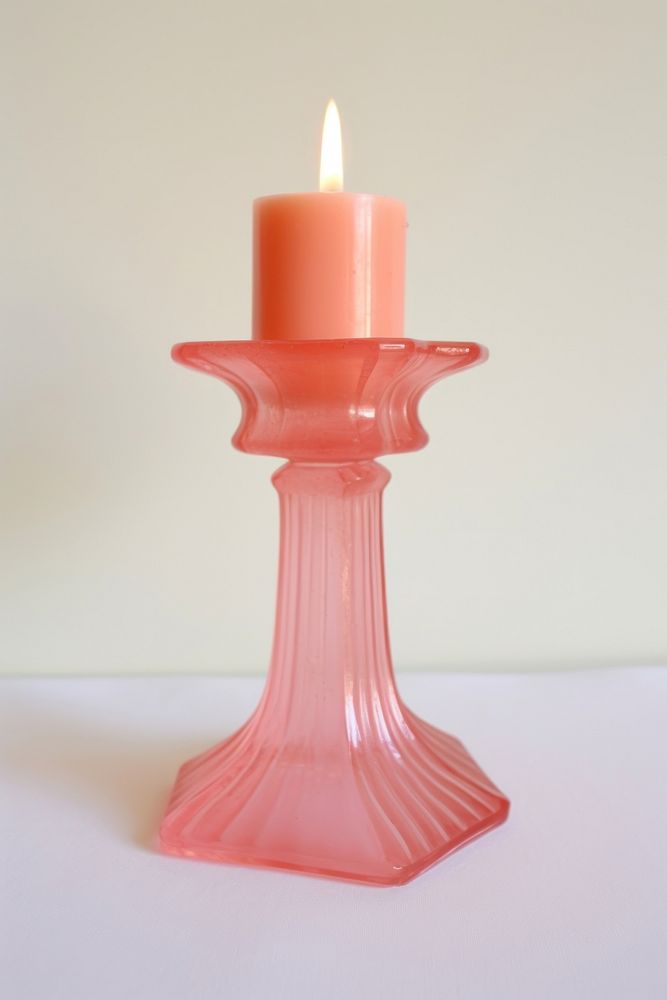 Pink retro glass candlestick holder lighting festival burning.