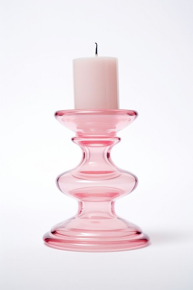 Pink retro glass candlestick holder white background lighting fire.
