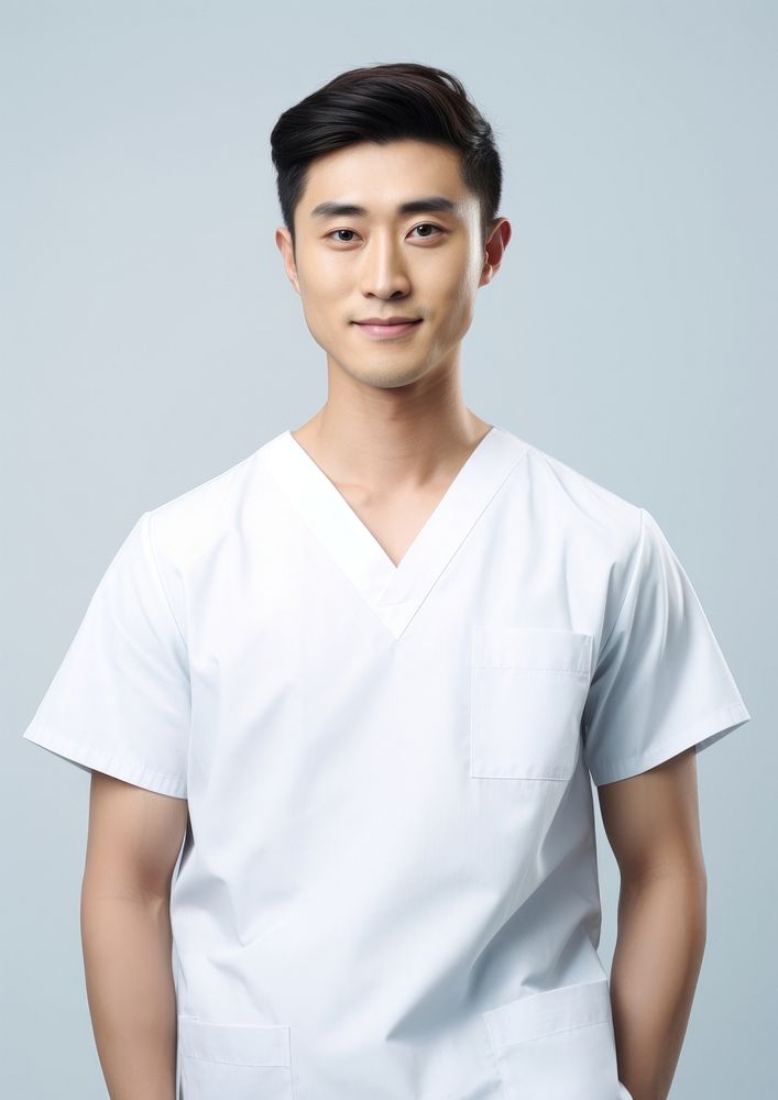 Asian men wearing white medical scrubs suits portrait adult white background.