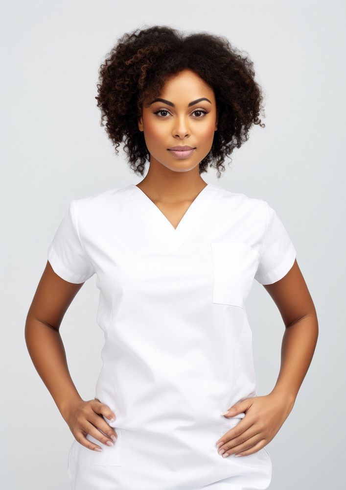 Black women wearing white medical scrubs suits portrait sleeve blouse.