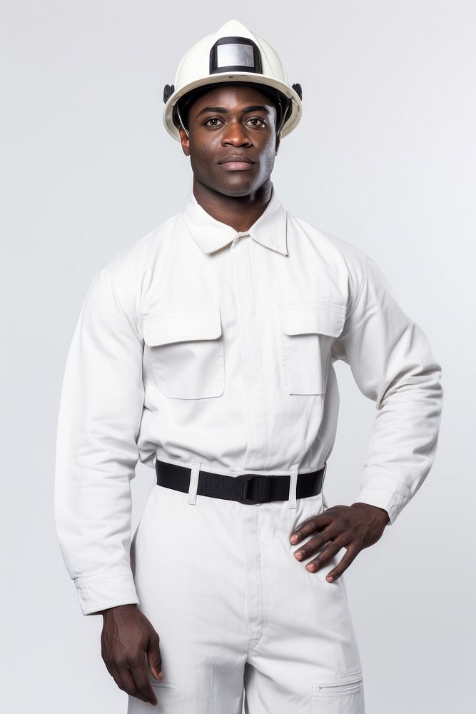Black man wearing white fireman uniform portrait helmet shirt.