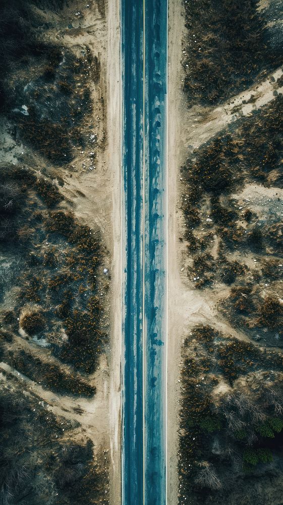 Aerial top down view of stunning lonely long road in america landscape outdoors nature.