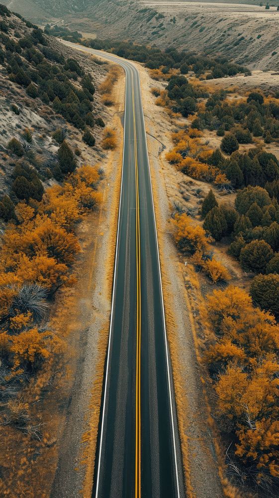Aerial top down view of stunning lonely long road in america landscape outdoors highway.
