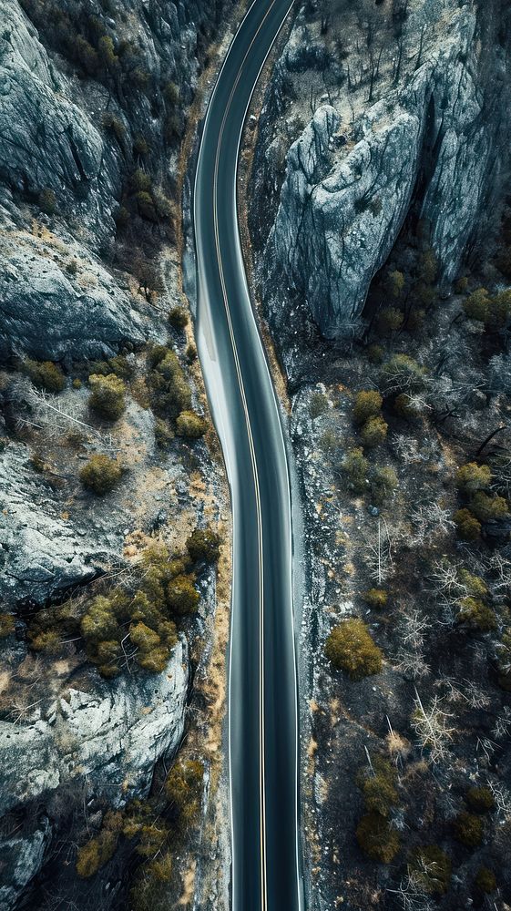 Aerial top down view of stunning lonely long road in america landscape outdoors nature.