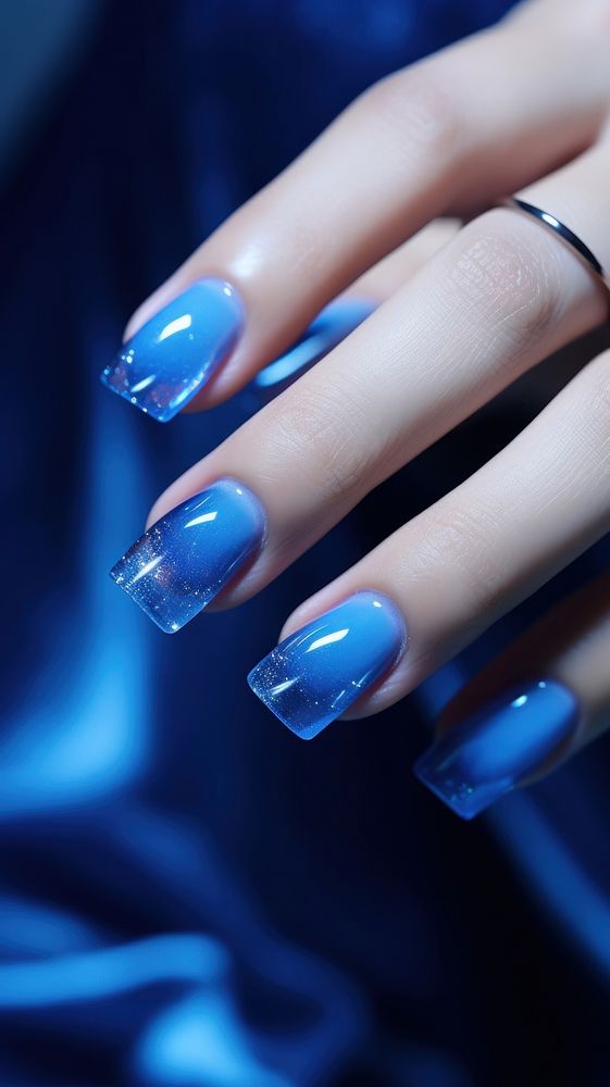  Beautiful blue nails cosmetics hand fingernail. AI generated Image by rawpixel.