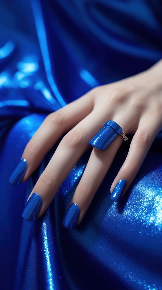  Beautiful blue nails cosmetics finger hand. AI generated Image by rawpixel.
