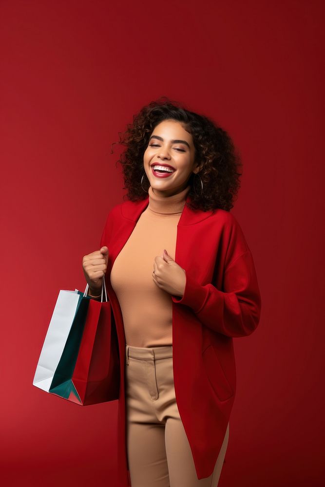 Happy young Latin lady holding shopping bags and a megaphone handbag smile adult.