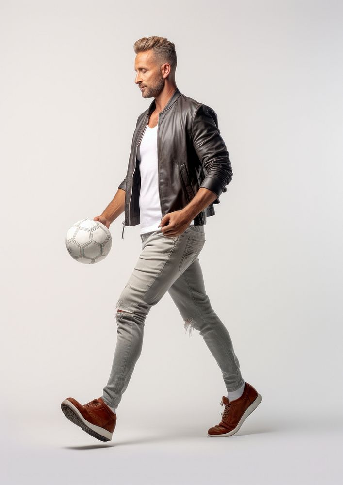A man holding football footwear sports person. AI generated Image by rawpixel.