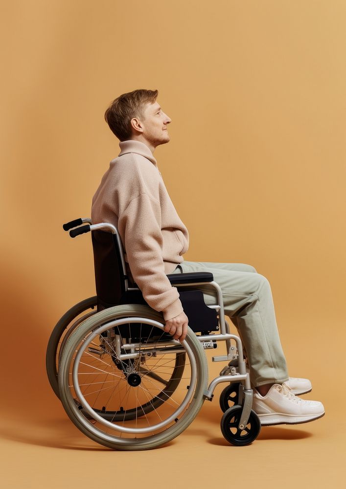 A man on wheelchair sitting person human. AI generated Image by rawpixel.