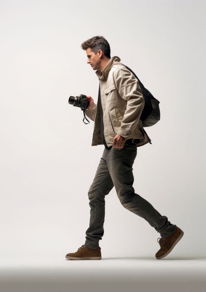 A camera man shooting a photo portrait walking jacket. AI generated Image by rawpixel.
