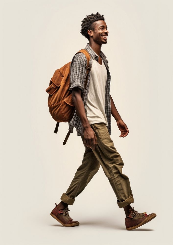 A happy African traveler walking footwear backpack. AI generated Image by rawpixel.