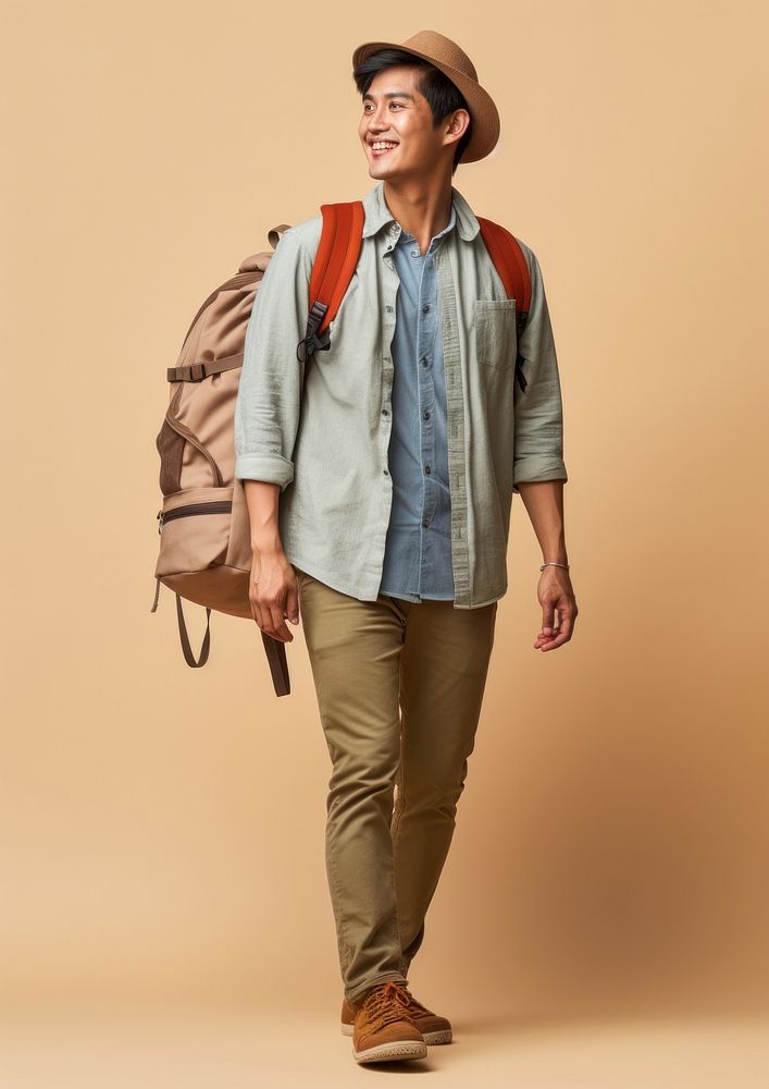 A happy Asian traveler backpack footwear walking. AI generated Image by rawpixel.