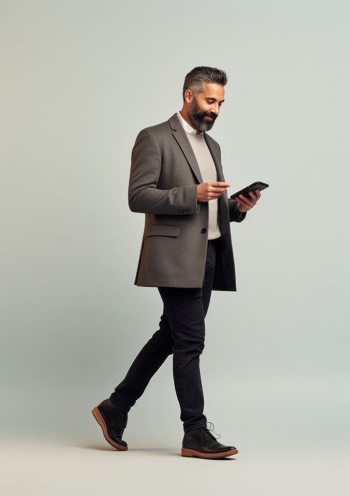 A hispanic businessman with mobilephone footwear portrait blazer. AI generated Image by rawpixel.