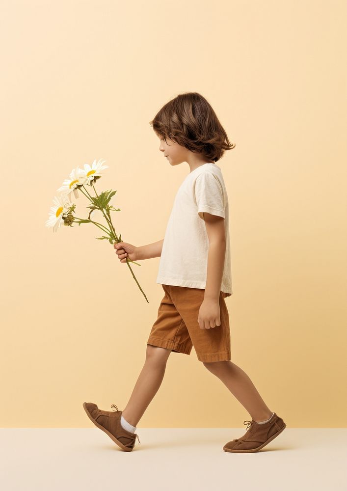 A kid with flower walking footwear person. AI generated Image by rawpixel.