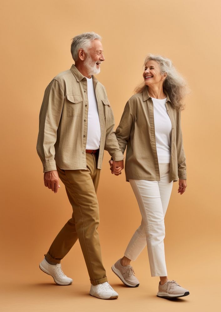 A senior couple with mobile phone walking footwear person. AI generated Image by rawpixel.