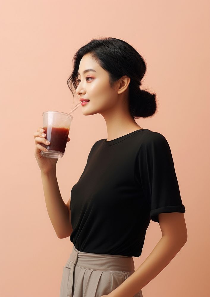 An Asian woman drinking boba tea portrait sleeve adult. AI generated Image by rawpixel.