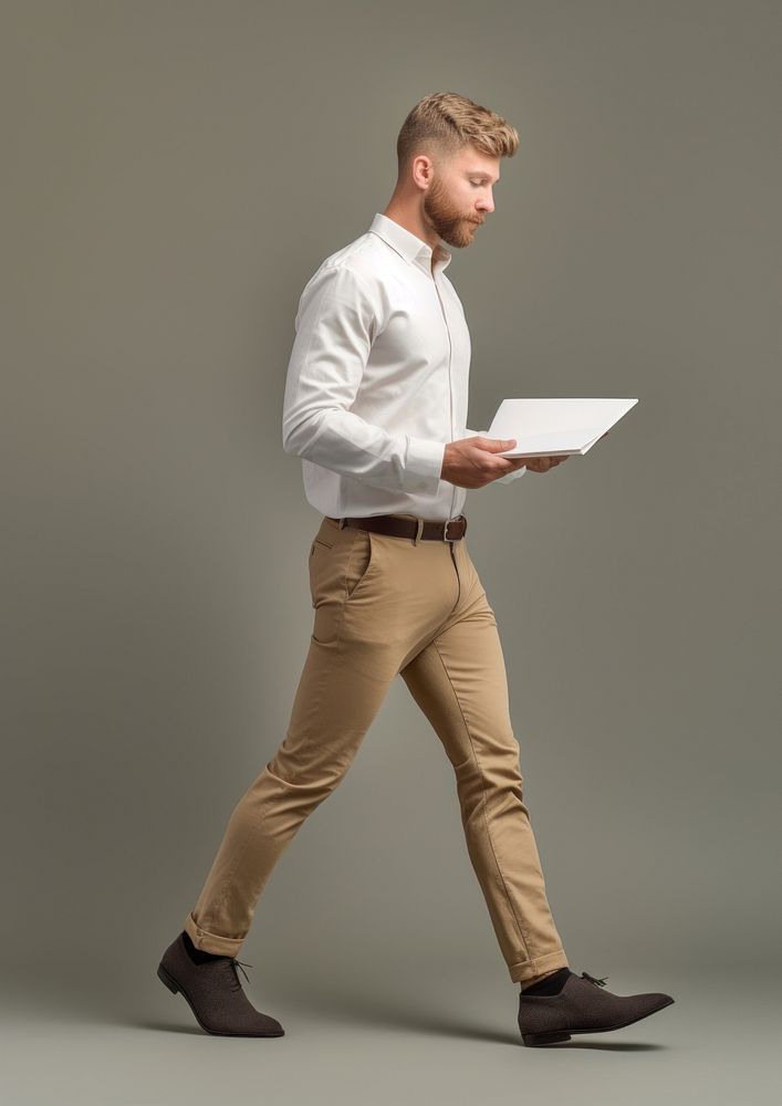 An engineer holding paper standing person adult. AI generated Image by rawpixel.