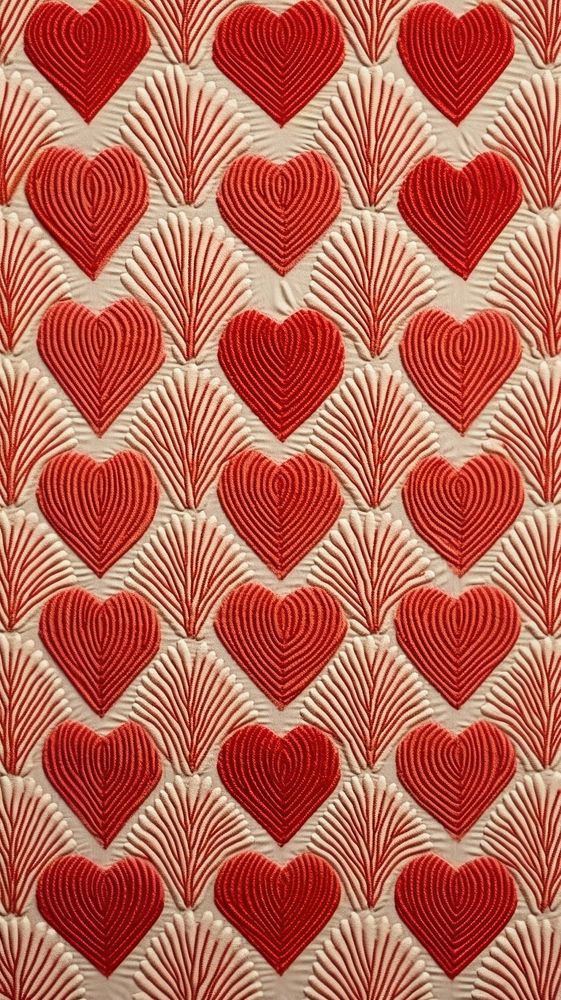 Embroidery of heart pattern textile texture quilt.
