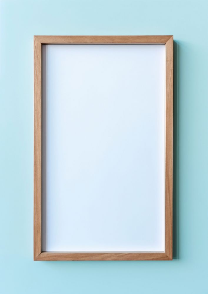 Wood empty frame backgrounds blue wall.