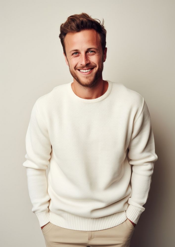 A happy british man wear cream sweater portrait smile photo.