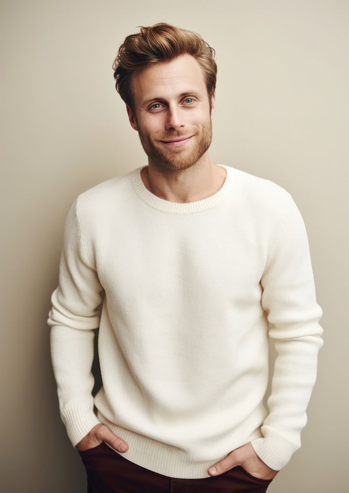 A happy british man wear cream sweater fashion individuality sweatshirt.