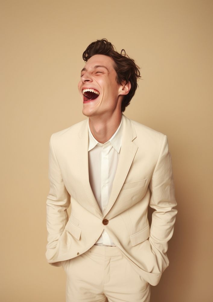A happy british man wear cream casual suit laughing fashion adult.
