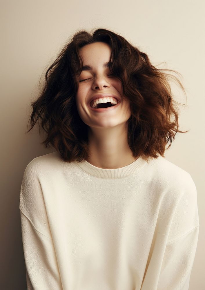 A happy british woman wear cream sweater laughing fashion adult.