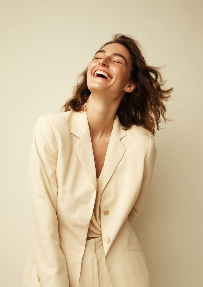 A happy british woman wear cream casual suit laughing fashion adult.