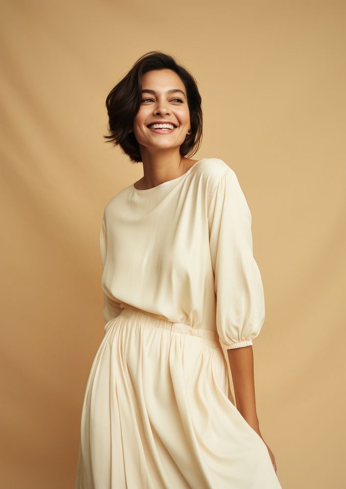 A happy hispanic woman wear cream dress fashion adult smile.