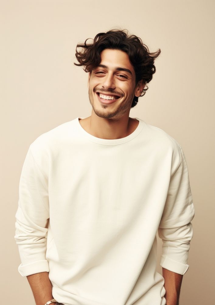 A happy hispanic man wear cream sweater laughing fashion adult.