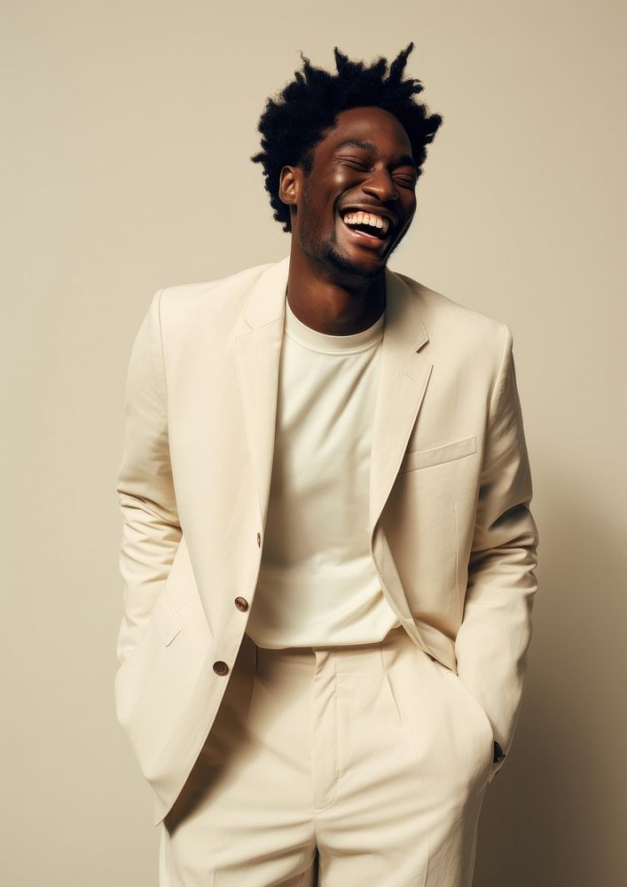 A happy mixed race african american man wear cream casual suit adult smile happiness.