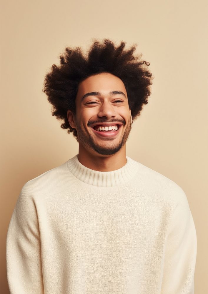 A happy mixed race british man wear cream sweater laughing smile individuality.