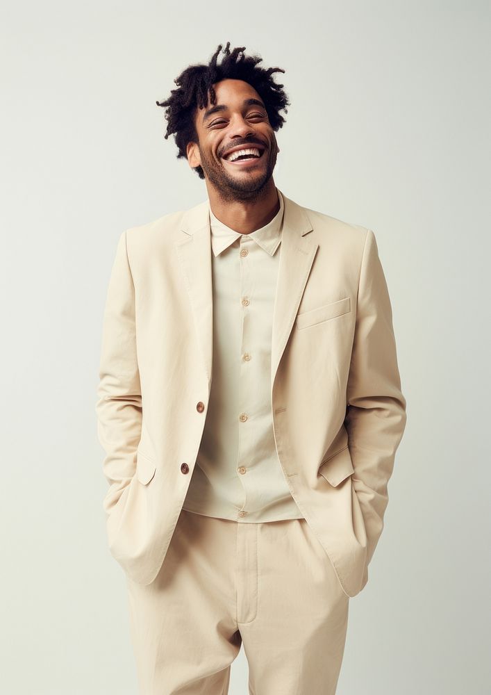 A happy mixed race british man wear cream casual suit fashion blazer adult.