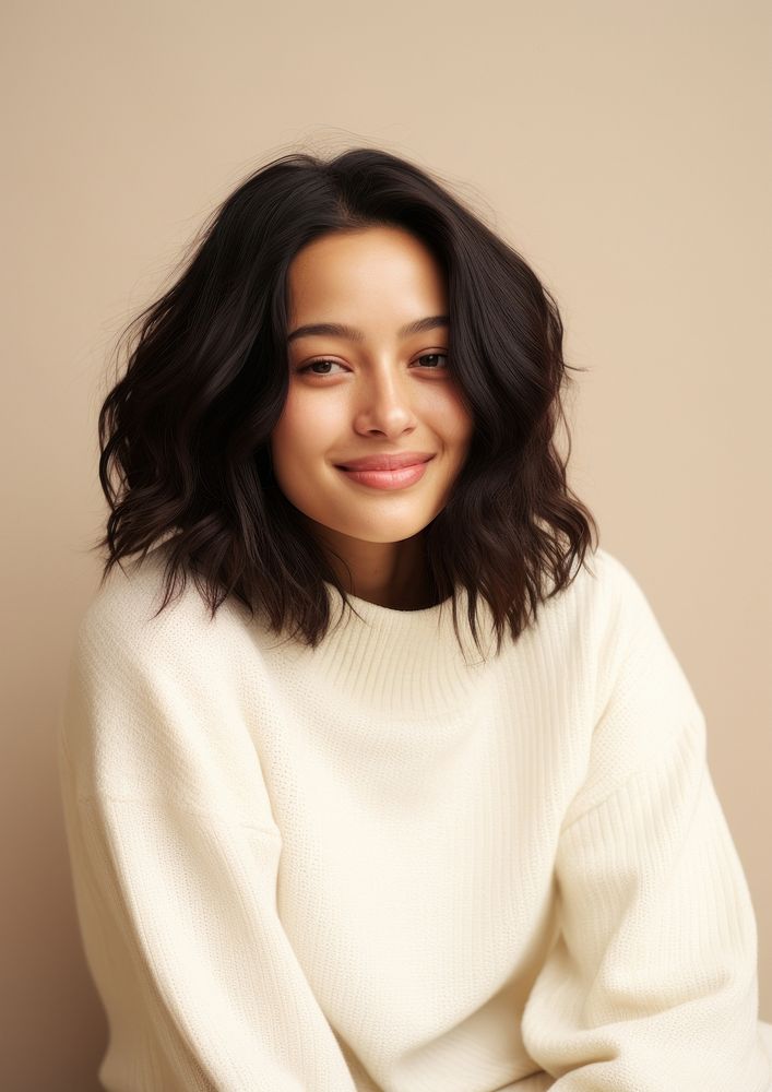 A happy mixed race japanese woman wear cream sweater fashion adult smile.