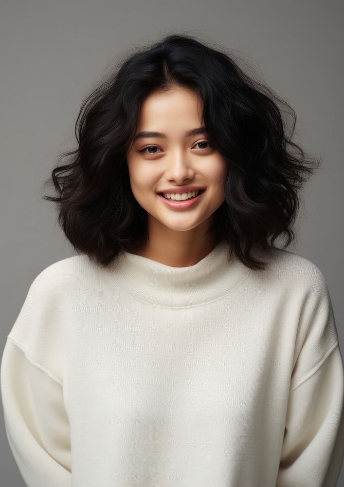 A happy mixed race japanese woman wear cream sweater portrait fashion adult.