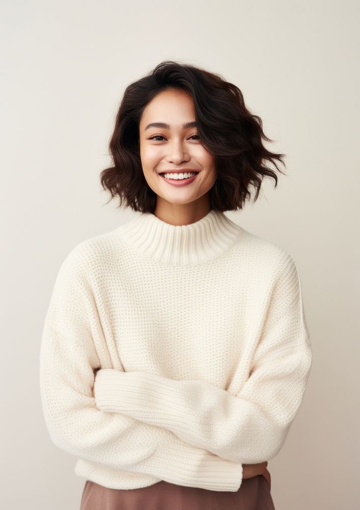 A happy mixed race japanese woman wear cream sweater fashion smile architecture.