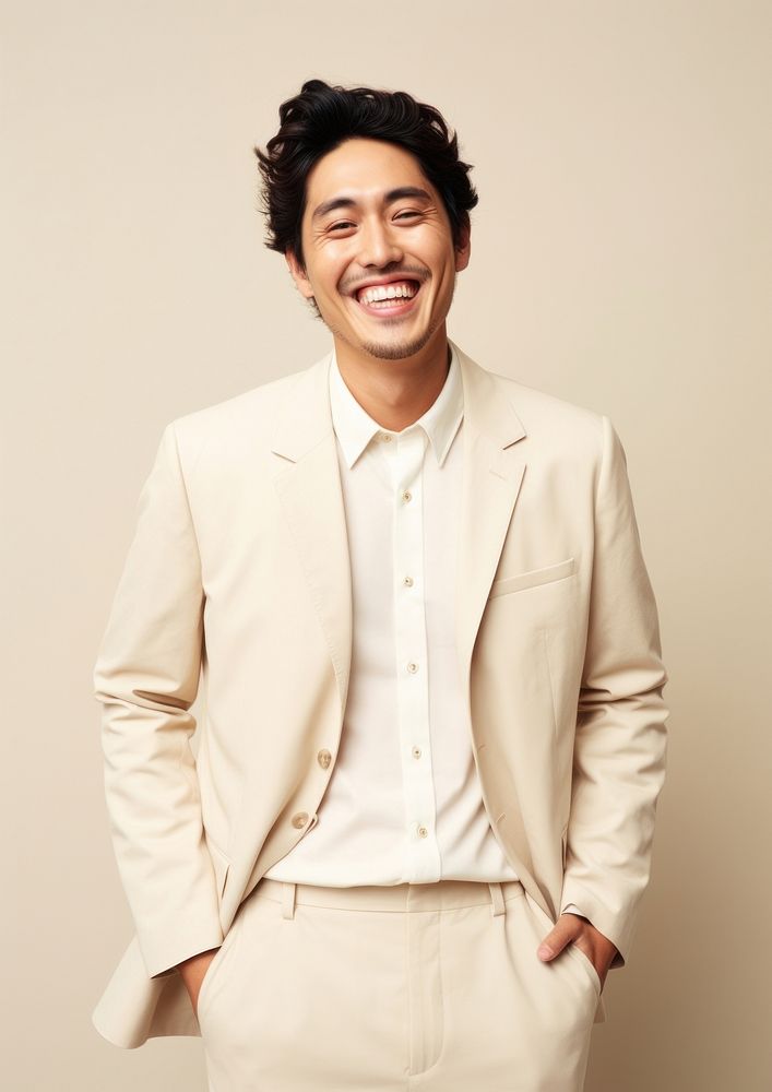 A happy mixed race japanese man wear cream casual suit blazer smile adult.