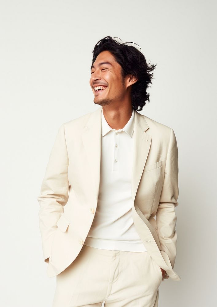 A happy mixed race japanese man wear cream casual suit blazer adult smile.