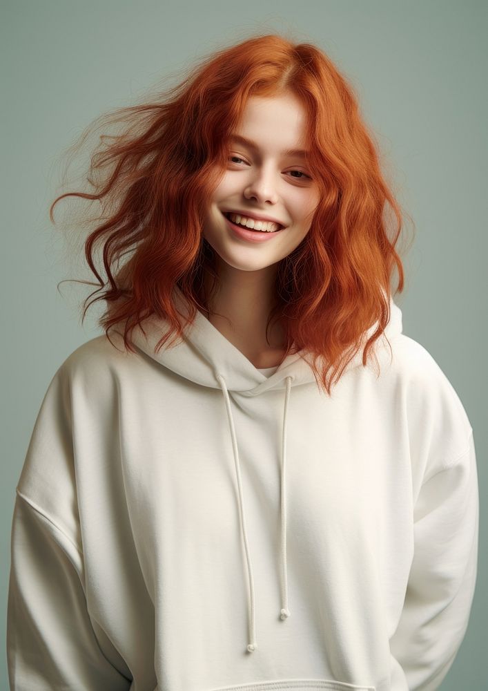 A happy red hair teenager wear cream hoodie portrait fashion adult.