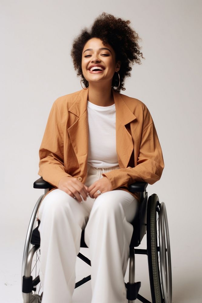 A disabled woman wheelchair laughing smiling. 
