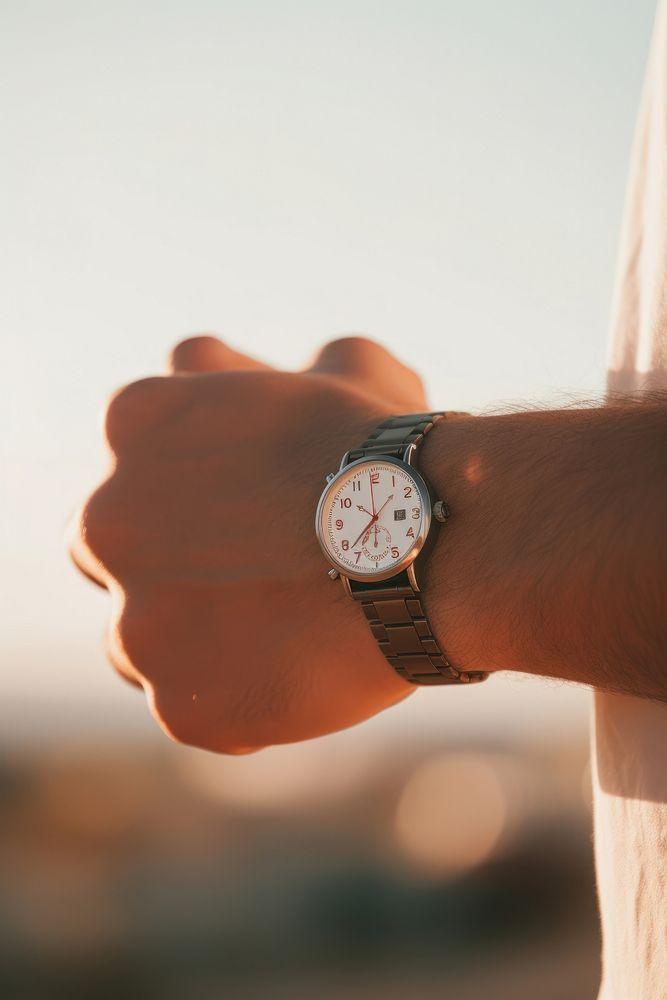 A hand wearing watch wristwatch finger accuracy.