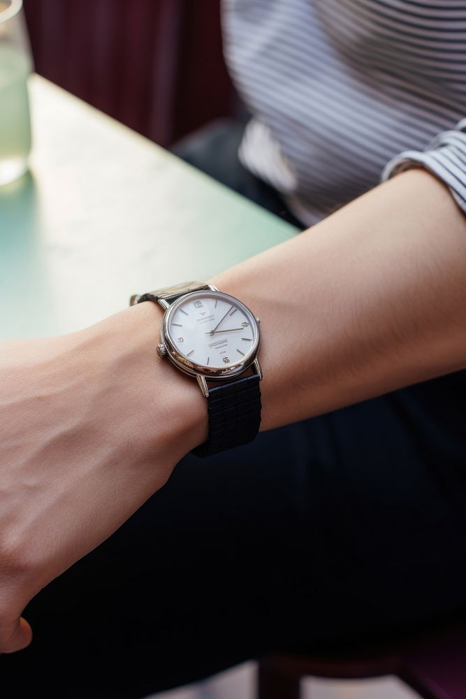 A hand wearing watch wristwatch adult man.