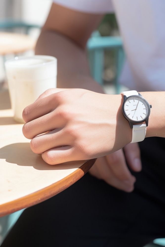 A hand wearing watch wristwatch finger cafe.