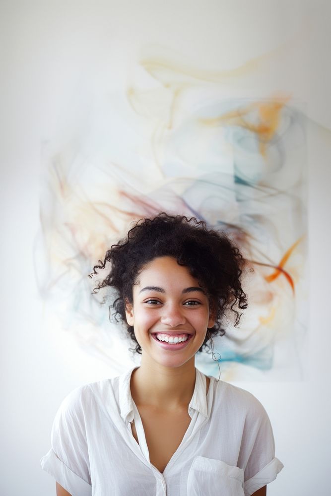A mixed race american-african woman photography portrait smiling.